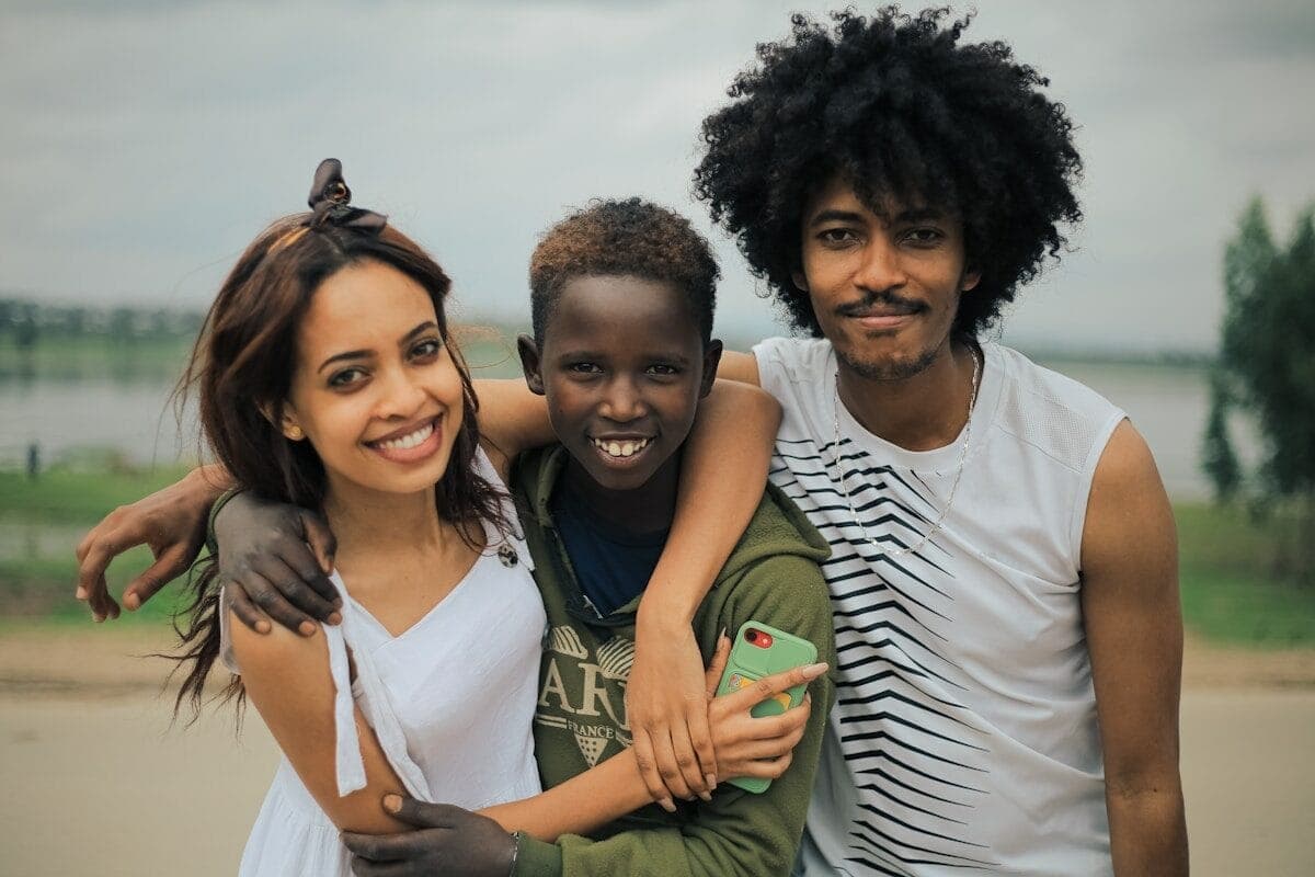 man in white crew neck shirt beside woman in green crew neck shirt