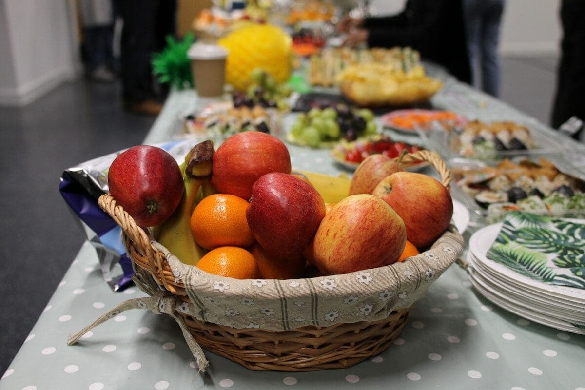 a basket of fruit is sitting on a table