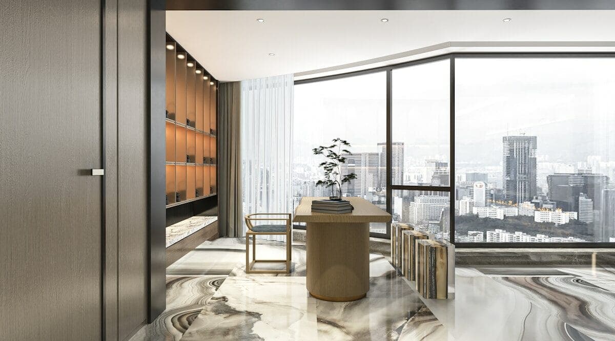 a room with a table, chairs, and a large window