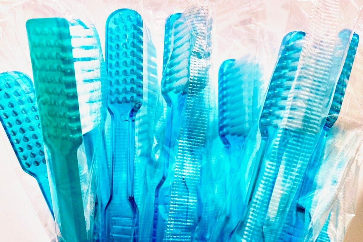 blue and white plastic hair comb